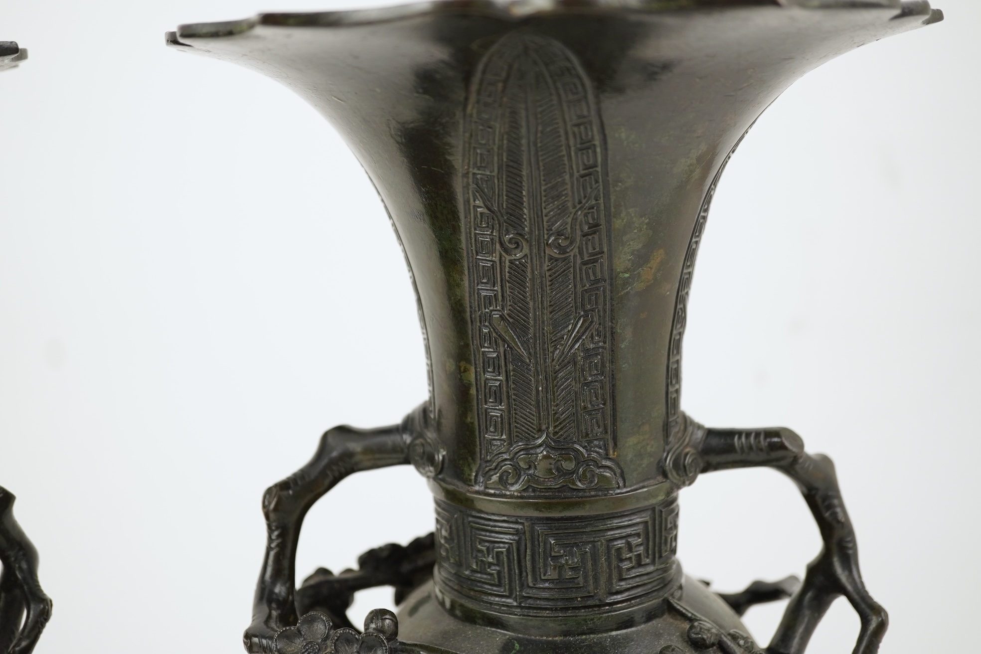 A pair of Chinese bronze gu-shaped vases, Qing dynasty